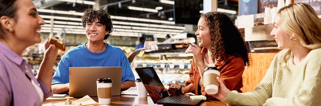 Four co-workers having a meeting at a cafe