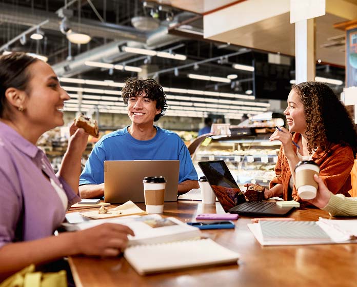 Four co-workers having a meeting at a cafe