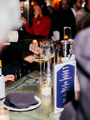 Server pouring wine at Sapphire event